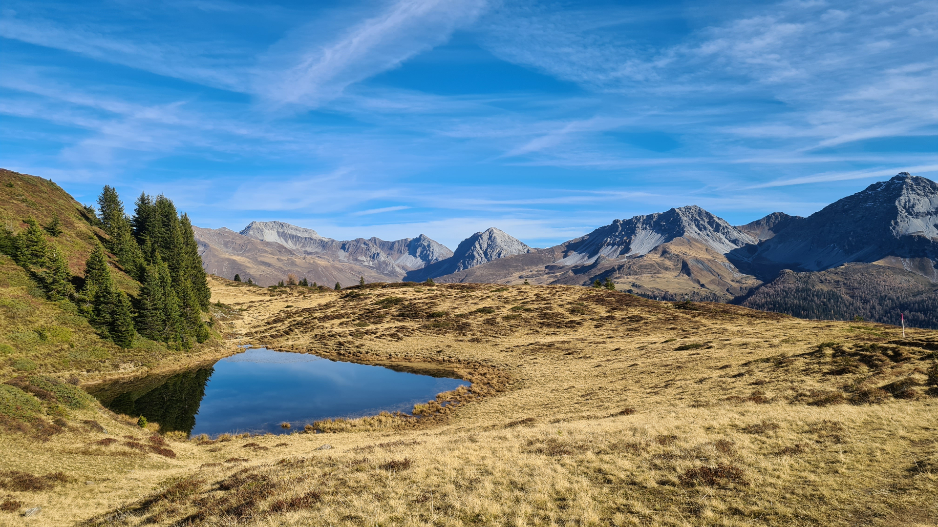 Alpine lake below the Amselflue, Furggahorn and Schiesshorn - the view from Casa Culmet